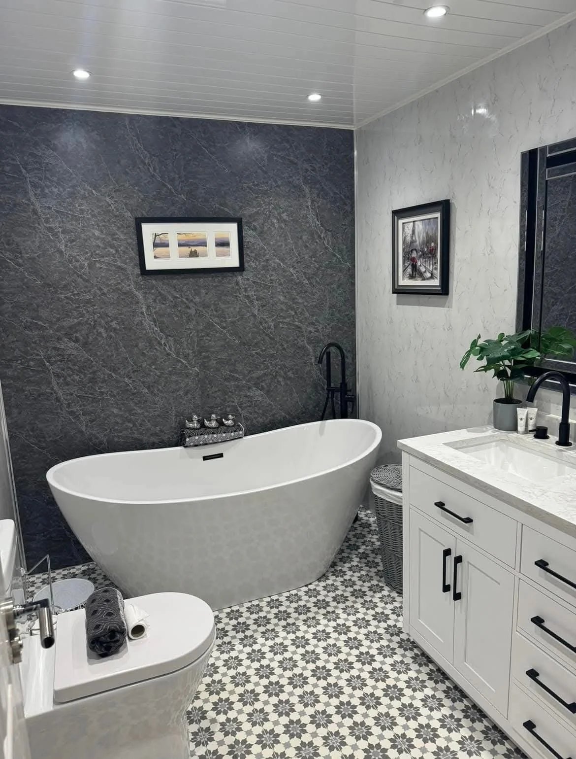 Freestanding bath and vanity in a finished bathroom