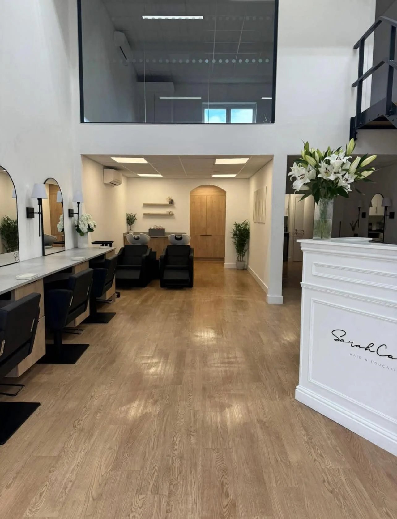 Hair salon interior after a commercial clean, Sarah Ca reception desk in view
